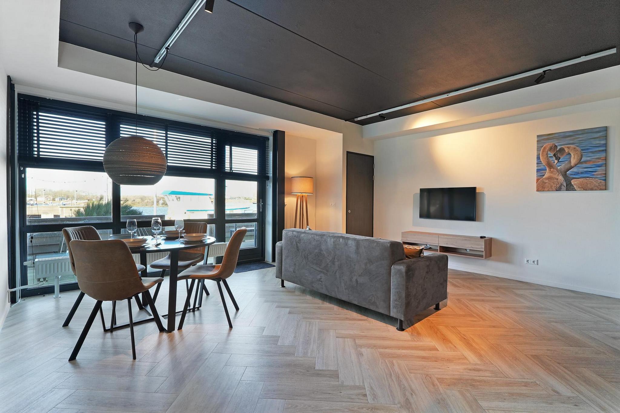 Luxuriöses Apartment mit Privatterrasse, geräumigem Wohnzimmer und herrlichem Blick auf den Binnenhafen.